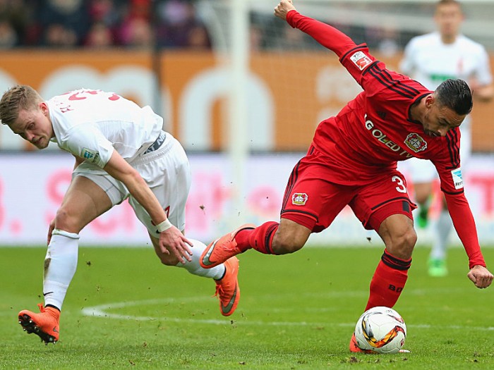 of Augsburg battles for the ball with of Leverkusen  during the Bundesliga match between FC Augsburg and Bayer Leverkusen at WWK Arena on March 5, 2016 in Augsburg, Germany.