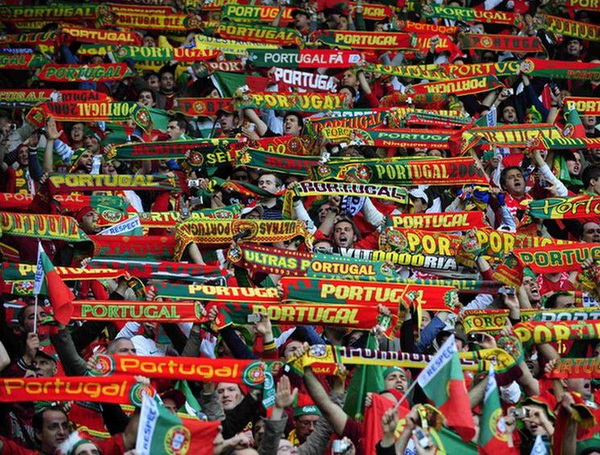 Portugal fans hold scarves aloft before their Group A Euro 2008 soccer match against Turkey at the Stade de Geneve in Geneva