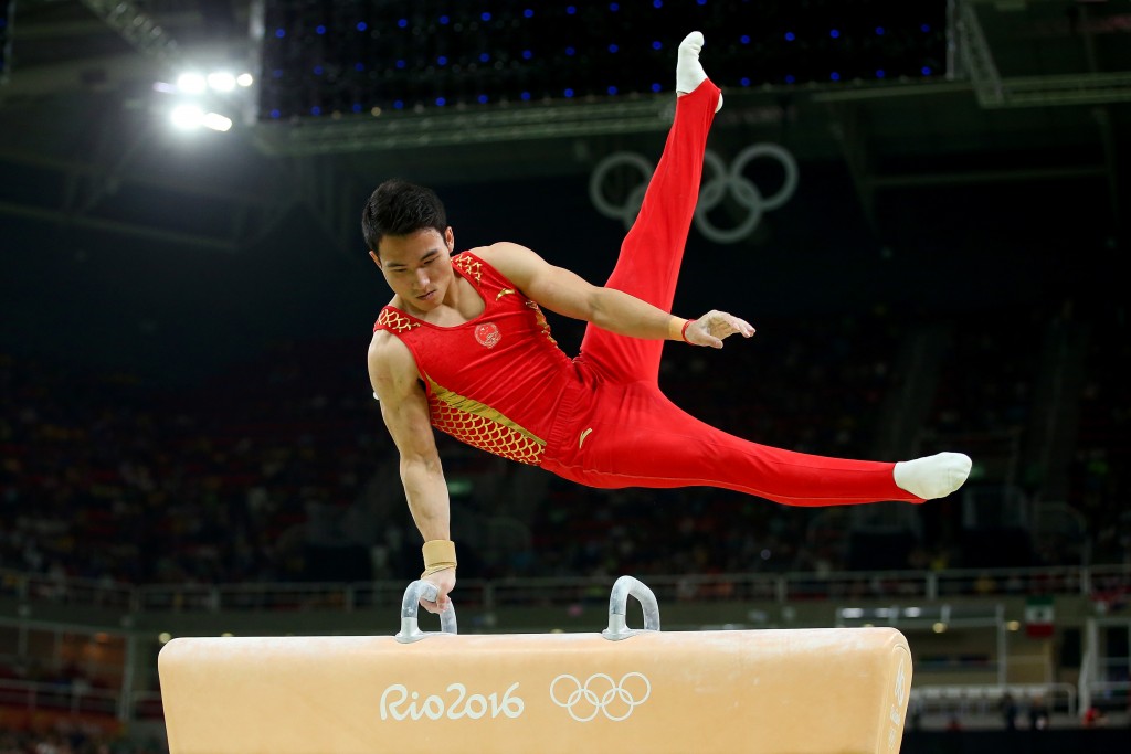 Китайский гимнаст в действии, Getty Images