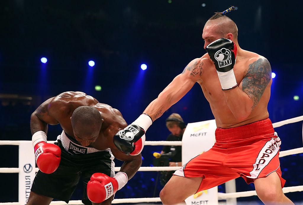 OBERHAUSEN, GERMANY - APRIL 26: Oleksandr Usyk (R) of Ukraine exchange punches with Ben Nsafoah (L) of Germany during their cruiserweight fight at Koenig-Pilsner Arena on April 26, 2014 in Oberhausen, Germany. (Photo by Martin Rose/Bongarts/Getty Images)