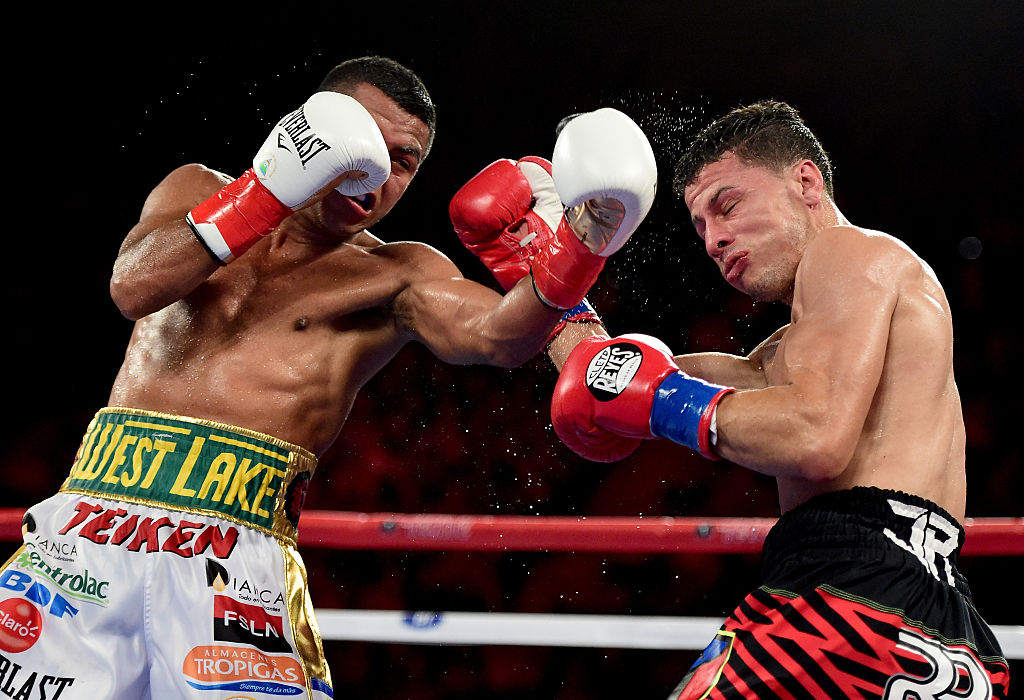 INGLEWOOD, CA - APRIL 23: Roman Gonzalez punches McWilliams Arroyo on way to a unanimous 12 round decision during a WBC flyweight title fight at The Forum on April 23, 2016 in Inglewood, California. (Photo by Harry How/Getty Images)