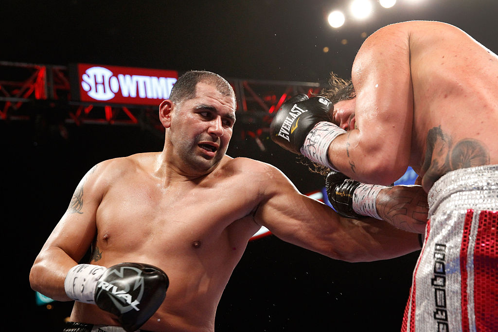 LAS VEGAS, NV - JANUARY 17: Eric Molina lands a punch on Raphael Zumbano during a heavyweight fight at the MGM Grand Garden Arena on January 17, 2015 in Las Vegas, Nevada. Molina won the fight with an eighth-round TKO. (Photo by Steve Marcus/Getty Images)